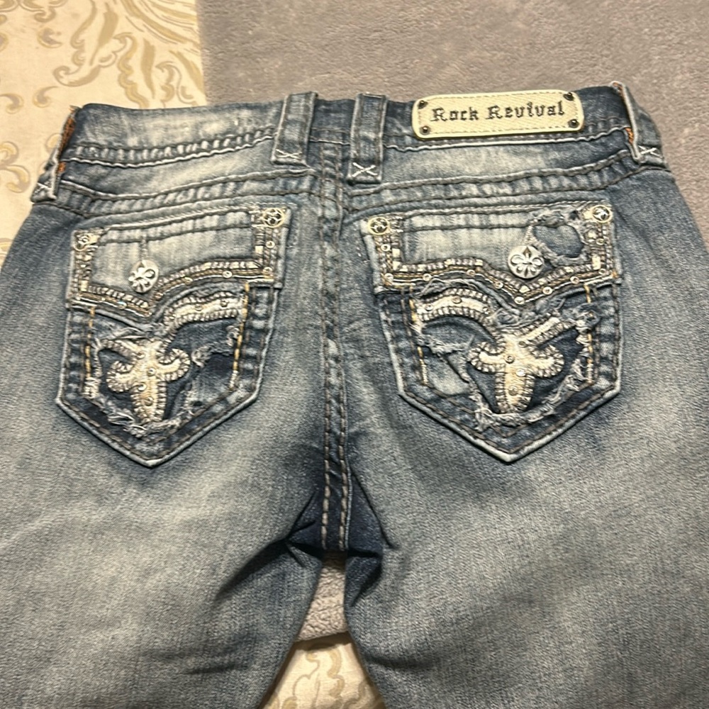 Rock revival woman’s boot leg destroyed jeans